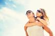 stockphotoholidaysvacationloveandfriendshipconceptsmilingcouplehavingfunoverskybackground274030400.jpg