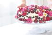 stockphotoberryfruitcakehomemadebiscuitcakewithcreaminwomanhandsagainstoflightsummerflowers1432195040.jpg