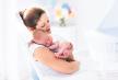 stockphotoyoungmotherholdinghernewbornchildmomnursingbabywomanandnewbornboyrelaxinawhite329743067.jpg