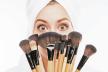 stockphotoattractivegirlhidingbehindmakeupbrushes364441628.jpg