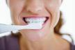 stockphotocloseuponhappywomanbrushingteeth164011439.jpg