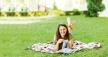 stockphotoayoungwomansittinginacityparkongreengrassandknittingabluesweaterwithknitting1351541705.jpg