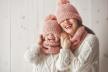 fraj-stockphotowinterportraitofhappylovingfamilywearingknittedhatssnoodsandsweatersmotherandchild770014903.jpg