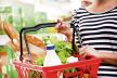 stockphotowomanshoppingatstorewithshoppingbasket215468632.jpg