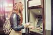 stockphotoyoungwomanwithdrawingmoneyfromcreditcardatatm401897728.jpg