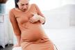 stockphotoasianpregnantwomansittingonbedsuffingfromheartburninthirdtrimester1457653139.jpg