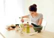 stockphotoyoungwomanmakingnourishingmaskwithavocadoinkitchen1135050707.jpg