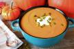 stockphotocreamypumpkinsouptoppedwithpumpkinseedsandcreaminabluebowlcloseup323548619.jpg