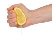 stockphotohandsqueezinglemonisolatedonwhite45982114.jpg