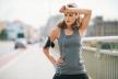 stockphotoawomanjoggeristakingabreakwipingsweatfromherforeheadwithherforearmshestakinga288544748-fraj.jpg