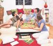 stockphotoayoungfamilyisplayingboardgamesintheirbed58926421.jpg