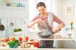 stockphotohealthyfoodathomehappywomanispreparingthepropermealinthekitchen1397470610.jpg