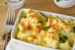 stockphotoadishofbakedgoldencauliflowercheeseandparsleygarnishsilverforktoleftglassoficed253815538.jpg