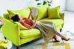 stockphotoelegantyoungwomanrestingonyellowsofawhilereadingbook1348988783-sm.jpg