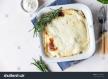 stockphotocauliflowergratinwithchickenandbechamelsaucedecoratedwithrosemaryinabakingdishsavory1932686231.jpg