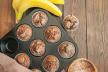 stockphotohomemadebananachocolatemuffinssprinkledwithsugarinabakingformonawoodenbackgroundtop710746129.jpg