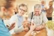 02-stockphotoseniorcoupleandgeriatricnursetogetherplayingpuzzleinretirementhome1436329454.jpg