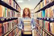 stockphotohappystudentgirlorwomanwithbooksinlibrary371574067.jpg