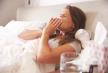 stockphotowomansufferingfromcoldlyinginbedwithtissue310310252.jpg