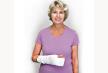 stockphotoseniorwomanwitharmandhandincastaftersurgeryorinjurygraybackground62478331.jpg