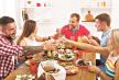 stockphotogroupofpeopleclinkglassessayingcheerseathealthymealsatpartydinnertableincafe515949436.jpg