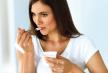 stockphotohealthydietandnutritioncloseupbeautifulsexysmilingyoungwomaneatingnaturalyogurt513613627.jpg