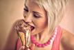 stockphotoyoungprettygirlwithshortblondhaireatingmeltingchocolateicecreamincone174475220.jpg