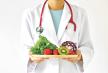 stockphotodoctorholdingfreshfruitandvegetablehealthydietnutritionfoodasaprescriptionforgood534096772.jpg