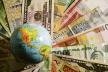 stockphotoglobemapsignovermanyamericandollarbanknotesandbillsofdifferentstatesinternational702171700.jpg