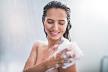 stockphotoportraitofhappygirltakingshowerwithgelshewashingwithpuff1134772001.jpg