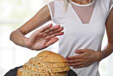 stockphotoglutenintoleranceanddietconceptwomanlrefusestoeatwhitebread732501385.jpg