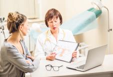 stockphotoyoungwomanpatientwithaseniorgynecologistduringtheconsultationintheoffice780769447.jpg