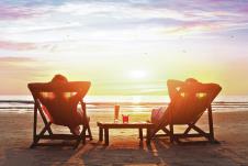 stockphotohappycoupleenjoyluxurysunsetonthebeachduringsummervacations265026164.jpg