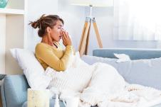 stockphotosickdayathomeyoungwomanhasrunnyandcommoncoldcoughcloseupofbeautifulyoungwoman1543398143.jpg