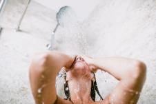 stockphotobeautifulwomantakingshowerinherbathroom1169109334.jpg