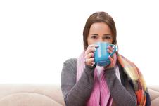 stockphotoyoungwomandrinkingteaduringfever524187808.jpg