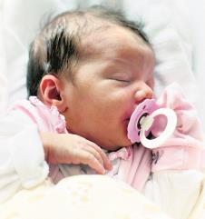 stockphotocutebabysleepingonthebed105593144.jpg