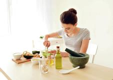 stockphotoyoungwomanmakingnourishingmaskwithavocadoinkitchen1135050707.jpg