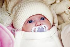 stockphotoadorablebabygirlwearingwhitewinterhat160730798.jpg