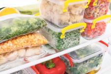 stockphotofrozenfoodintherefrigeratorvegetablesonthefreezershelvesstocksofmealforthewinter522663619.jpg