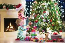 stockphotohappylittlekidsinmatchingredandgreenstripedpajamasdecoratechristmastreeinbeautiful492064579.jpg