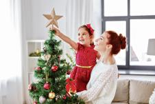 stockphotofamilywinterholidaysandpeopleconcepthappymotherandlittledaughterdecoratingchristmas1190199016.jpg