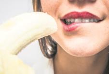 stockphotowomaneatingbanana514825333.jpg