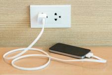 stockphotoelectricsocketwithconnectedphonecharger630671108.jpg