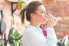 stockphotohomeyoungwomaninkitchen607960394.jpg