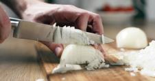 stockphotomancuttingwhiteonionwithknifewidephoto644261770.jpg