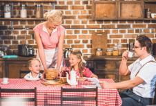 stockphotohappyretrostyledfamilyhavingbreakfasttogether1056257567.jpg