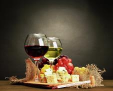 stockphotocompositionwithwinebluecheeseandgrapeonwoodentableongreybackground143992918.jpg