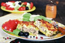 stockphotoportionofdeliciousgreekmoussakawithmincedmeatonrustictable434537794.jpg