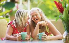 stockphotopairofcutemiddleagedfemalefriendslaughing300869585.jpg